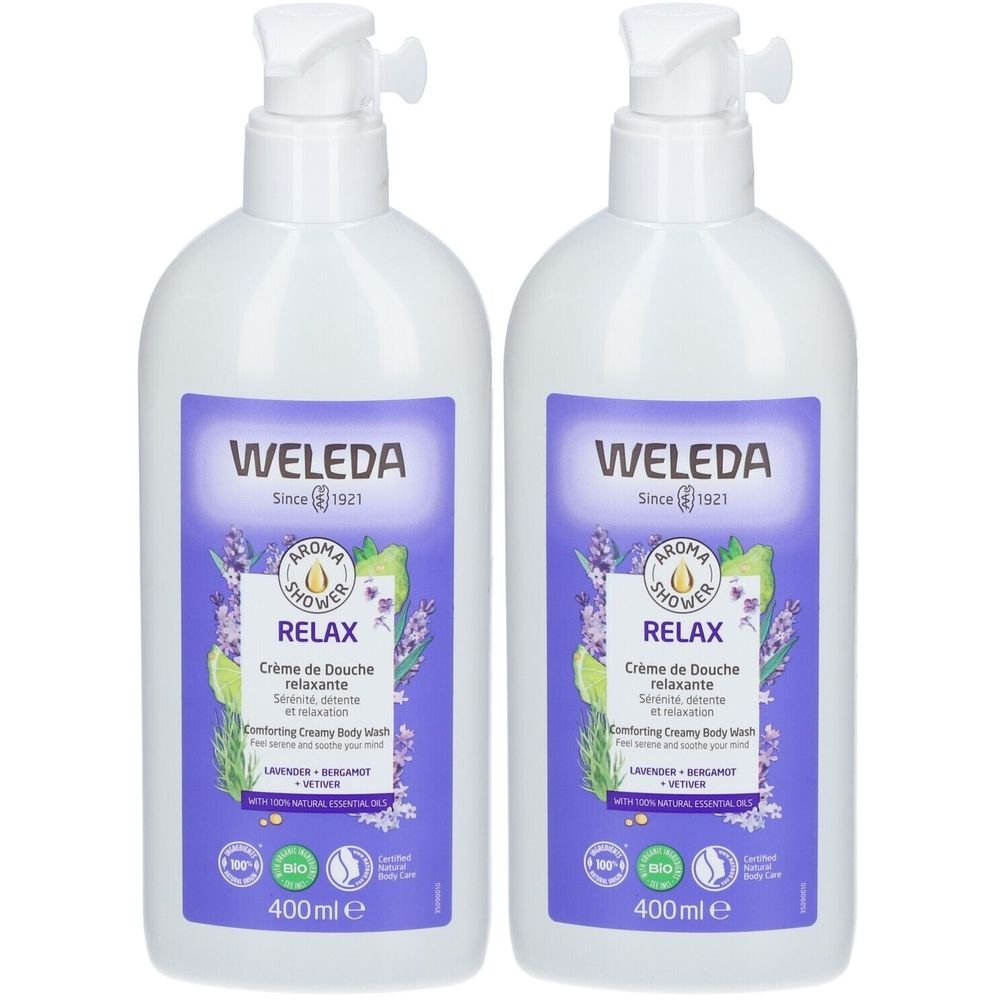 Deux flacons blancs avec des étiquettes violettes. Les étiquettes indiquent "WELEDA RELAX Crème de Douche relaxante".