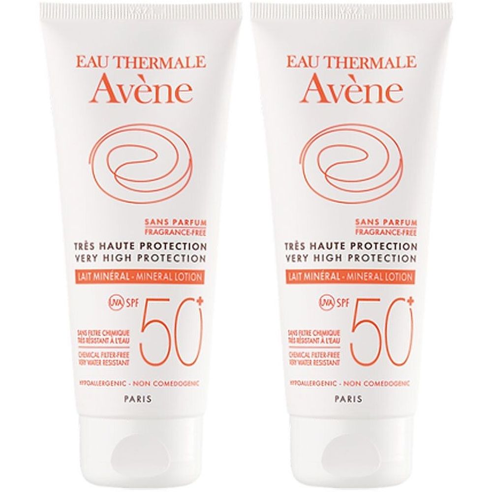 Deux tubes de Avène Solaire Lait Mineral SPF 50+. Tubes blancs avec texte orange. Inscription: Très Haute Protection, Lait Mineral.