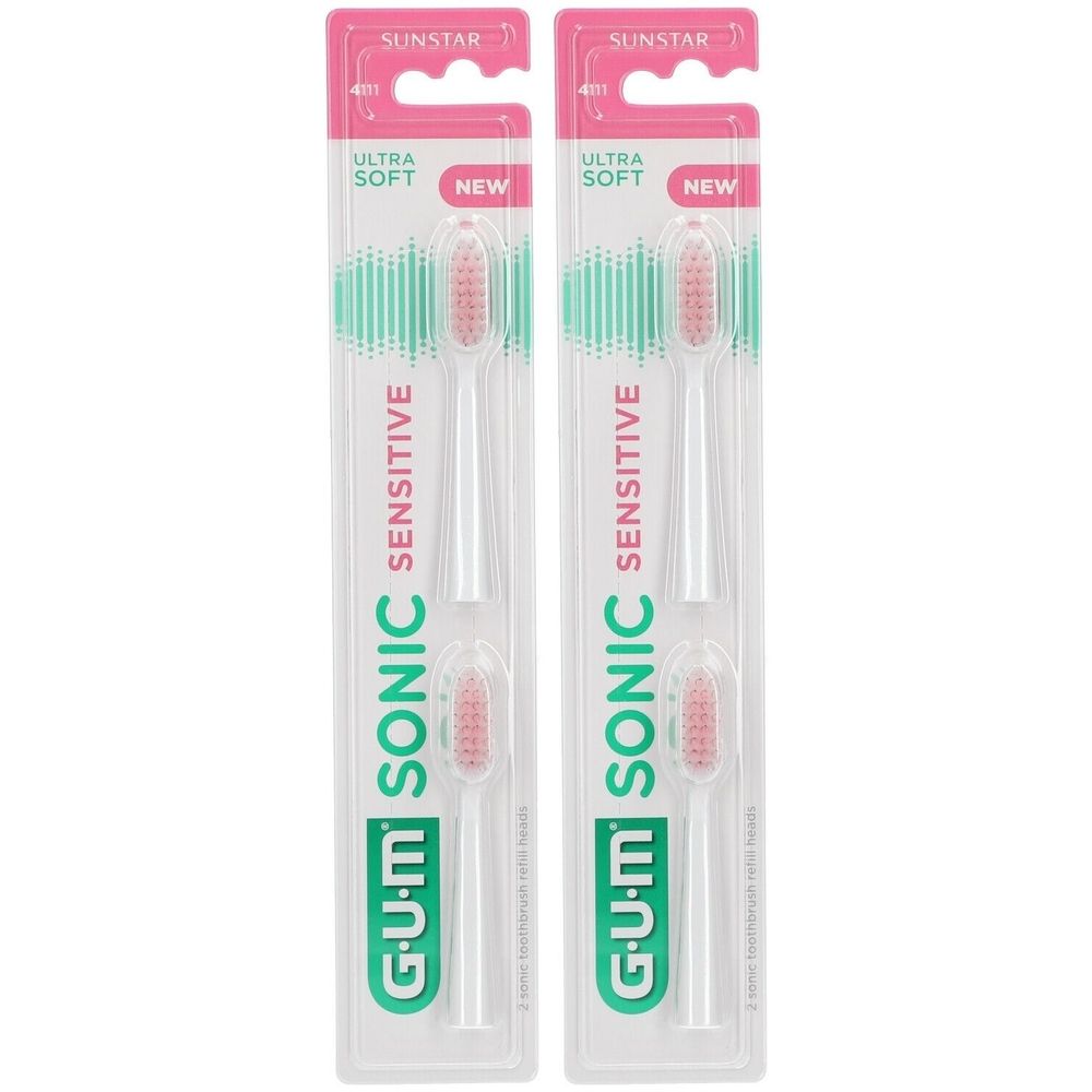 Deux têtes de brosse de rechange pour brosse à dents sonique. Manches blancs, soies roses. Emballage avec logos SUNSTAR et G.U.M.