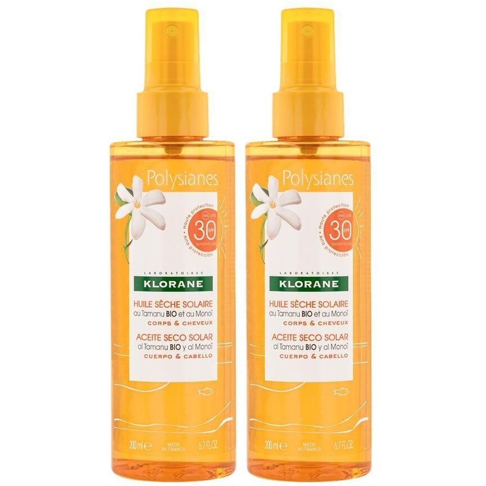 Deux flacons de spray contenant un liquide jaune. Inscriptions: KLORANE, Huile Sèche Solaire SPF30. Avec symboles floraux et protection solaire.