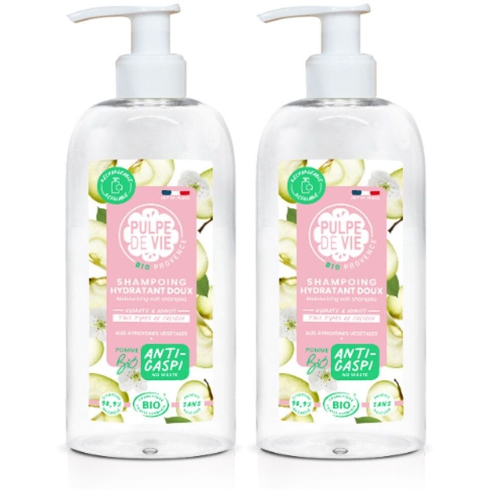 Deux flacons transparents avec pompe blanche. Étiquettes avec nom du produit et logo. Texte: SHAMPOING HYDRATANT DOUX, BIO.