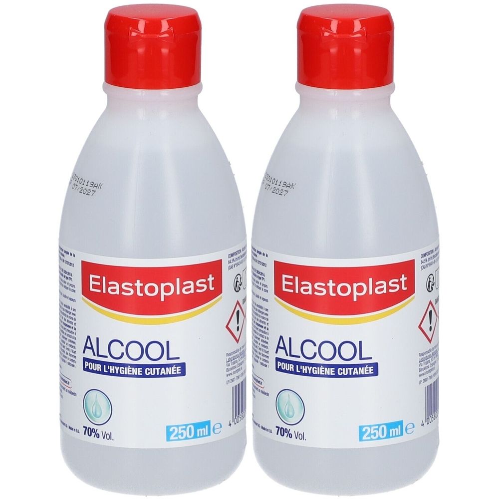 Deux flacons d'Elastoplast Alcool. Liquide clair dans des flacons transparents avec bouchon rouge. Étiquette avec informations produit.