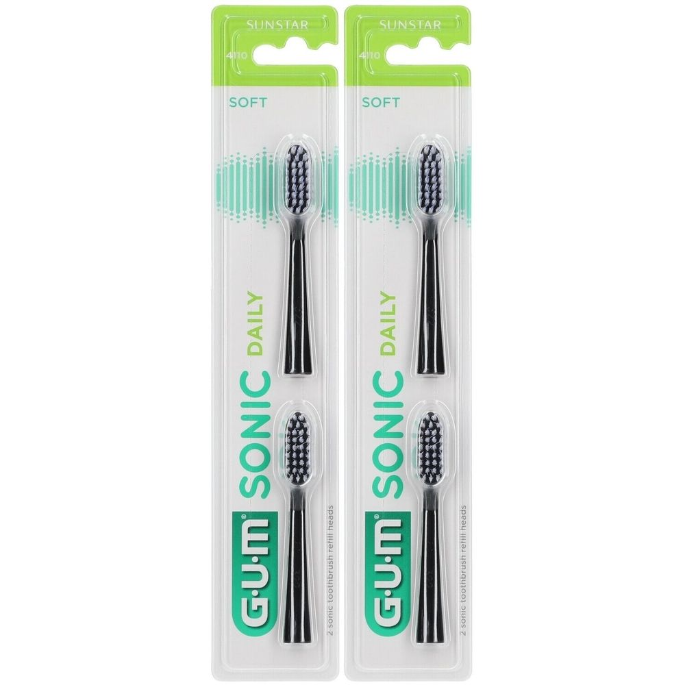 Deux paquets de têtes de brosse à dents noires. L'emballage affiche la marque G.U.M SONIC DAILY. Inscription : SOFT.
