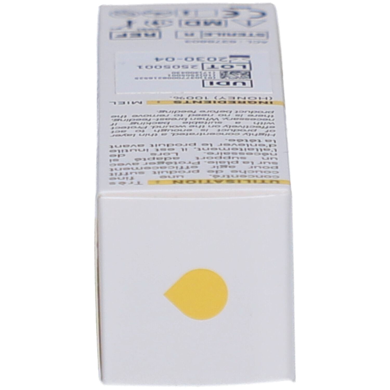 Extrémité de la boîte. Texte et marquages. Indications médicales. Goutte jaune.