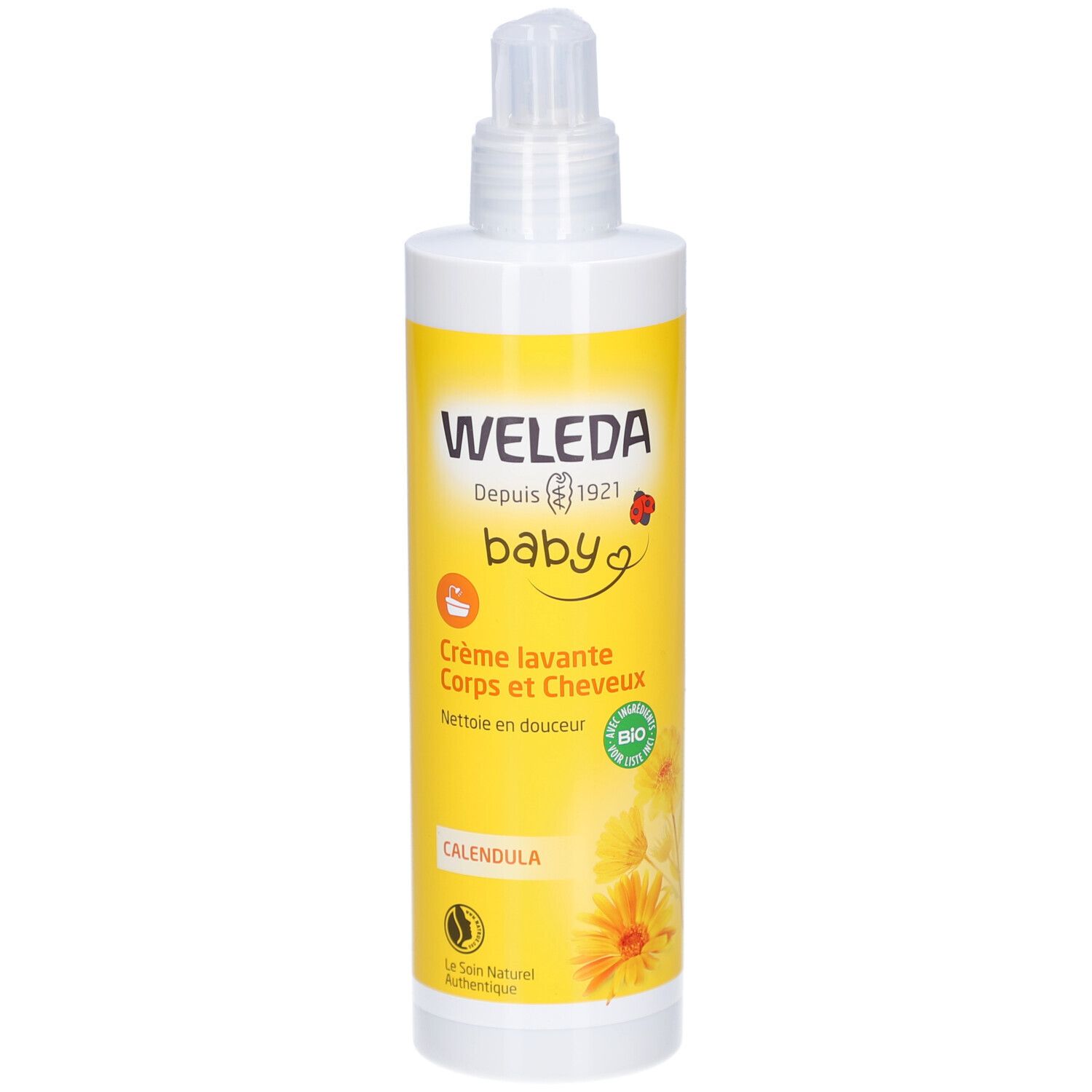 Flacon blanc avec étiquette jaune. Inscription: WELEDA baby Crème lavante Corps et Cheveux Calendula. Avec distributeur.