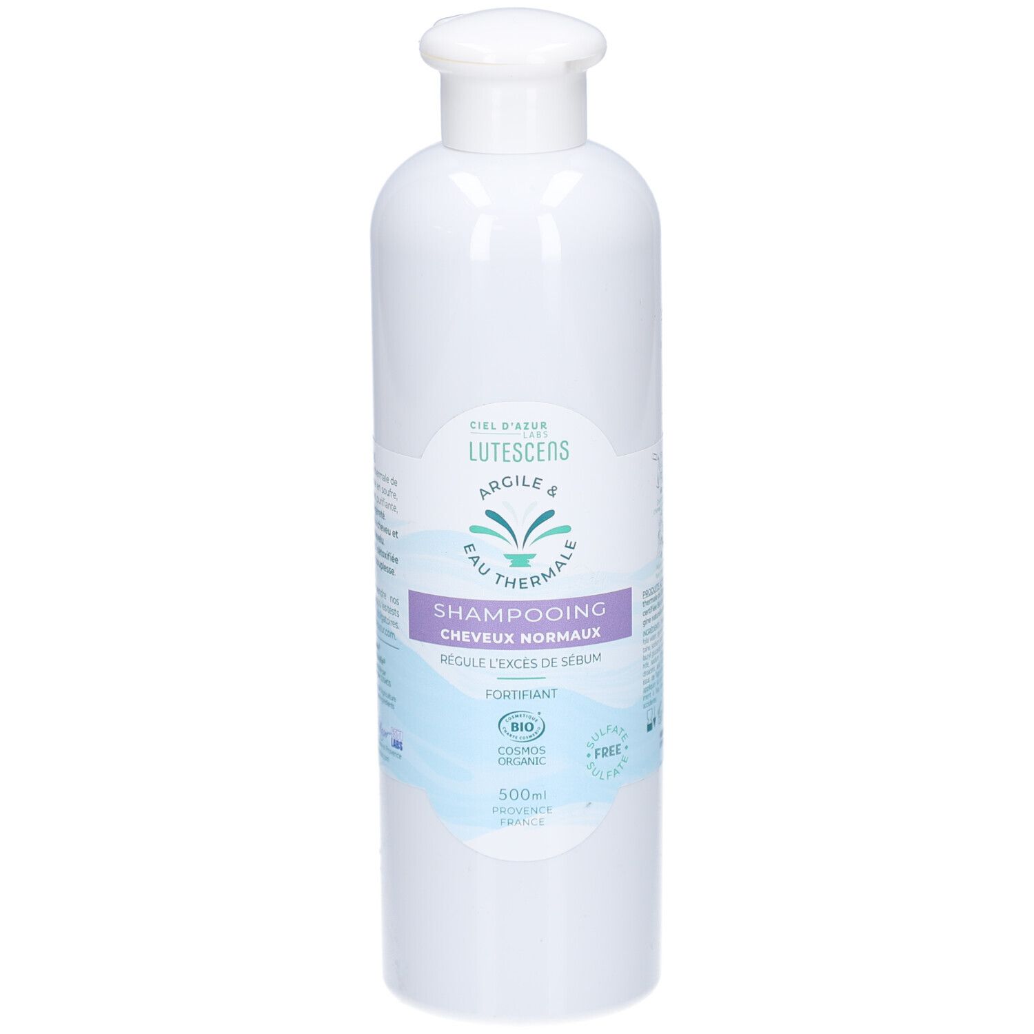 Flacon blanc de shampooing Lutescens. Inscription: Shampooing Cheveux Normaux. Certifié bio. Contient de l'argile et de l'eau thermale.