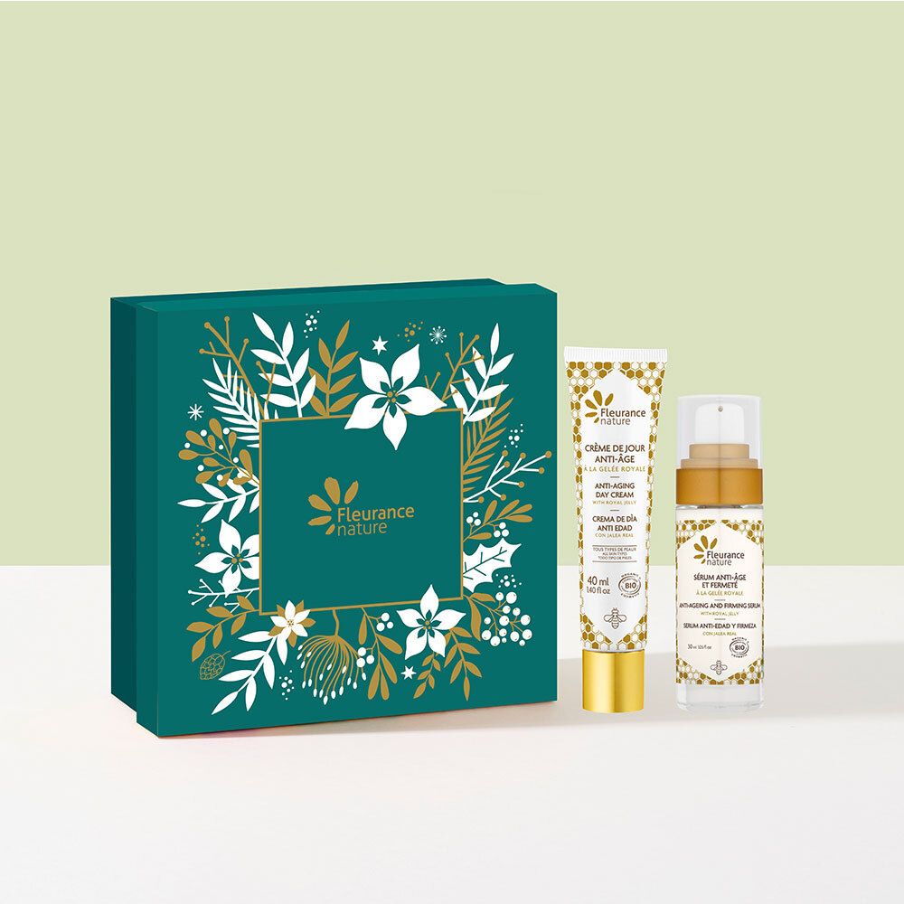 Coffret cadeau vert avec décor floral et logo. Contient deux tubes et un flacon. Inscriptions en français et anglais.