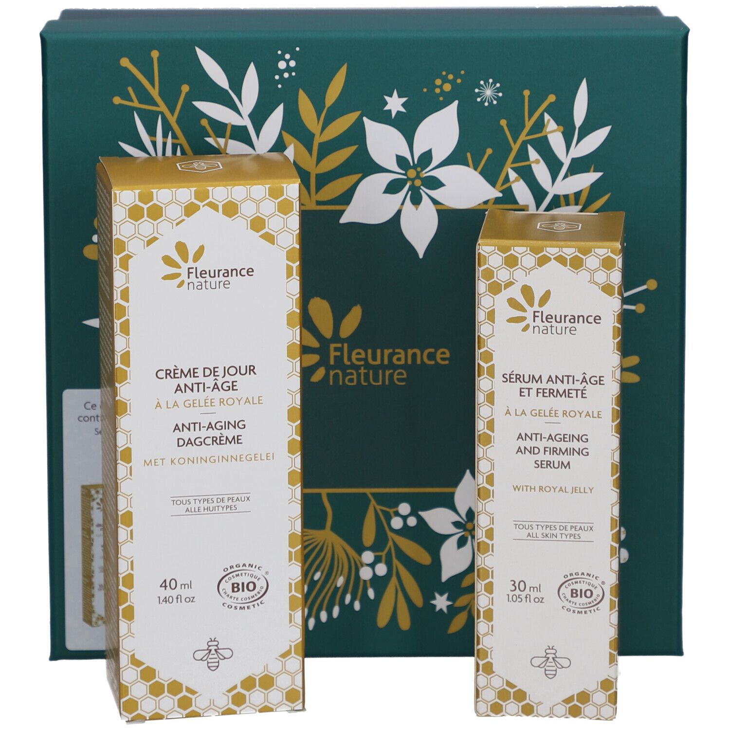 Deux boîtes de produits devant un coffret. Crème de jour et sérum. Marque: Fleurance nature. Certification bio.
