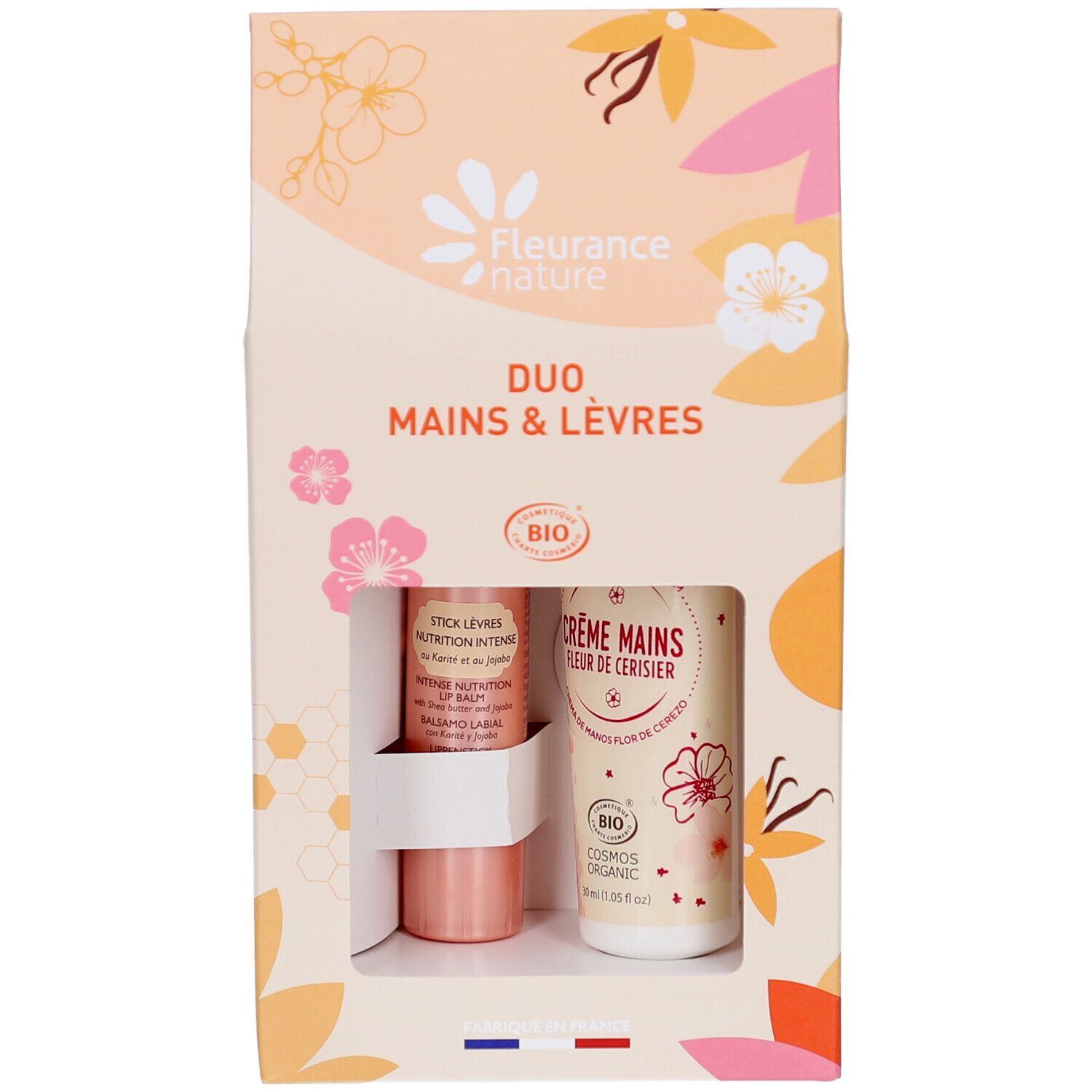 Coffret Duo Mains & Lèvres. Contient crème mains et stick lèvres. Produits et emballage visibles.