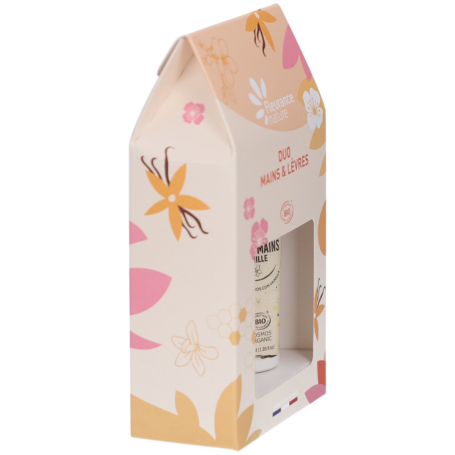 Vue latérale du coffret Duo Mains & Lèvres. Crème mains et stick lèvres partiellement visibles.