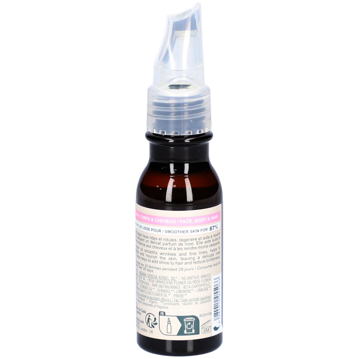 Flacon en verre brun avec étiquette. Texte: Huile d'Argan Parfumée à la Rose. Instructions d'utilisation pour peau et cheveux.