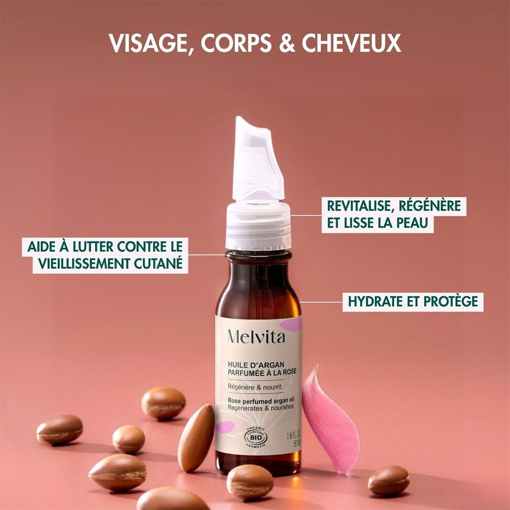 Flacon d'huile d'argan et pétales de rose. Texte: Visage, Corps & Cheveux. Textbox: Revitalise, régénère, hydrate.