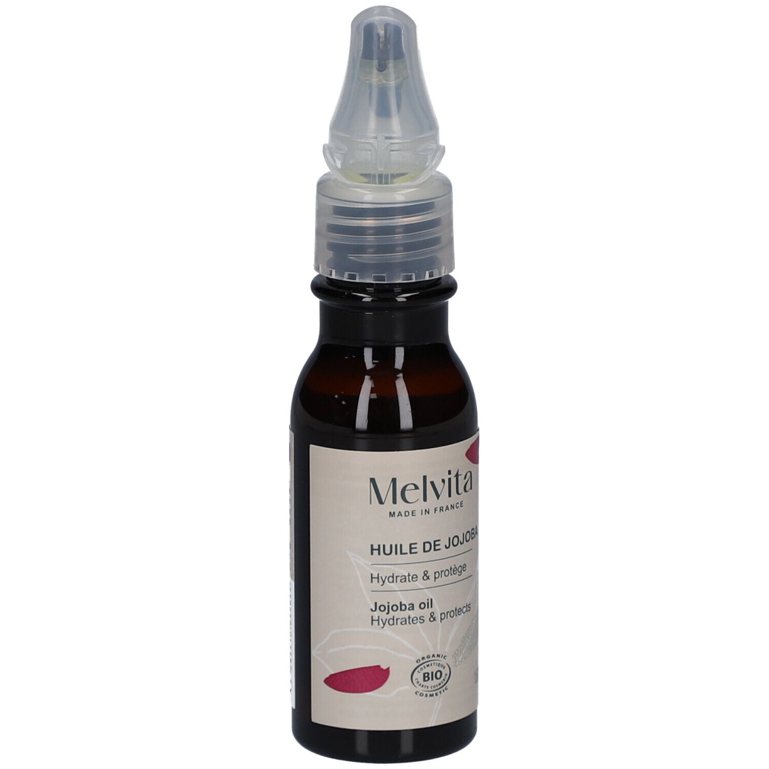Flacon en verre brun avec vaporisateur. Étiquette avec texte: Melvita, Huile de Jojoba, Hydrate & protège. Certification Bio.