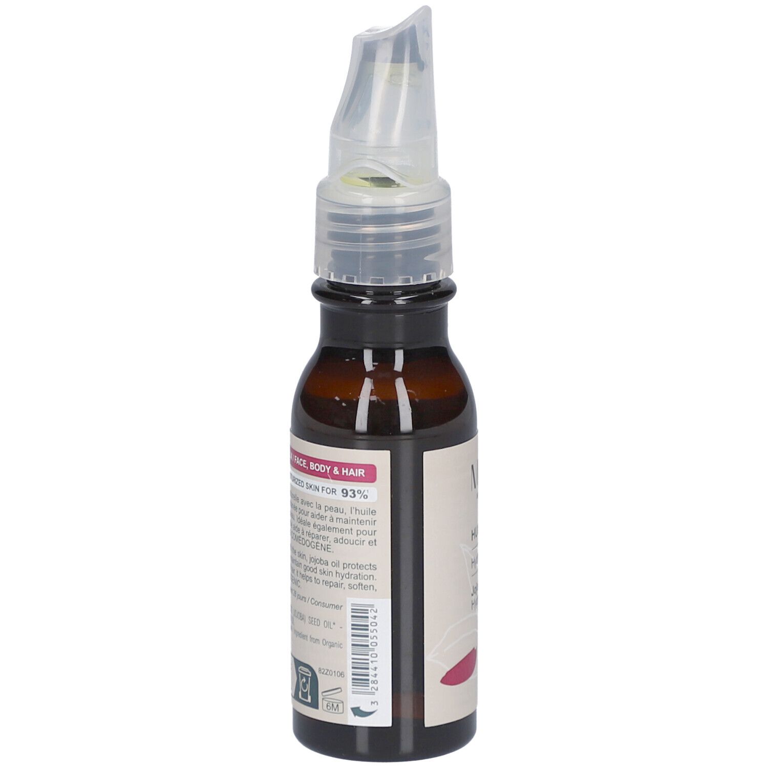 Flacon en verre brun avec vaporisateur. Étiquette avec texte. Contient des informations pour le visage, le corps et les cheveux. Bio.