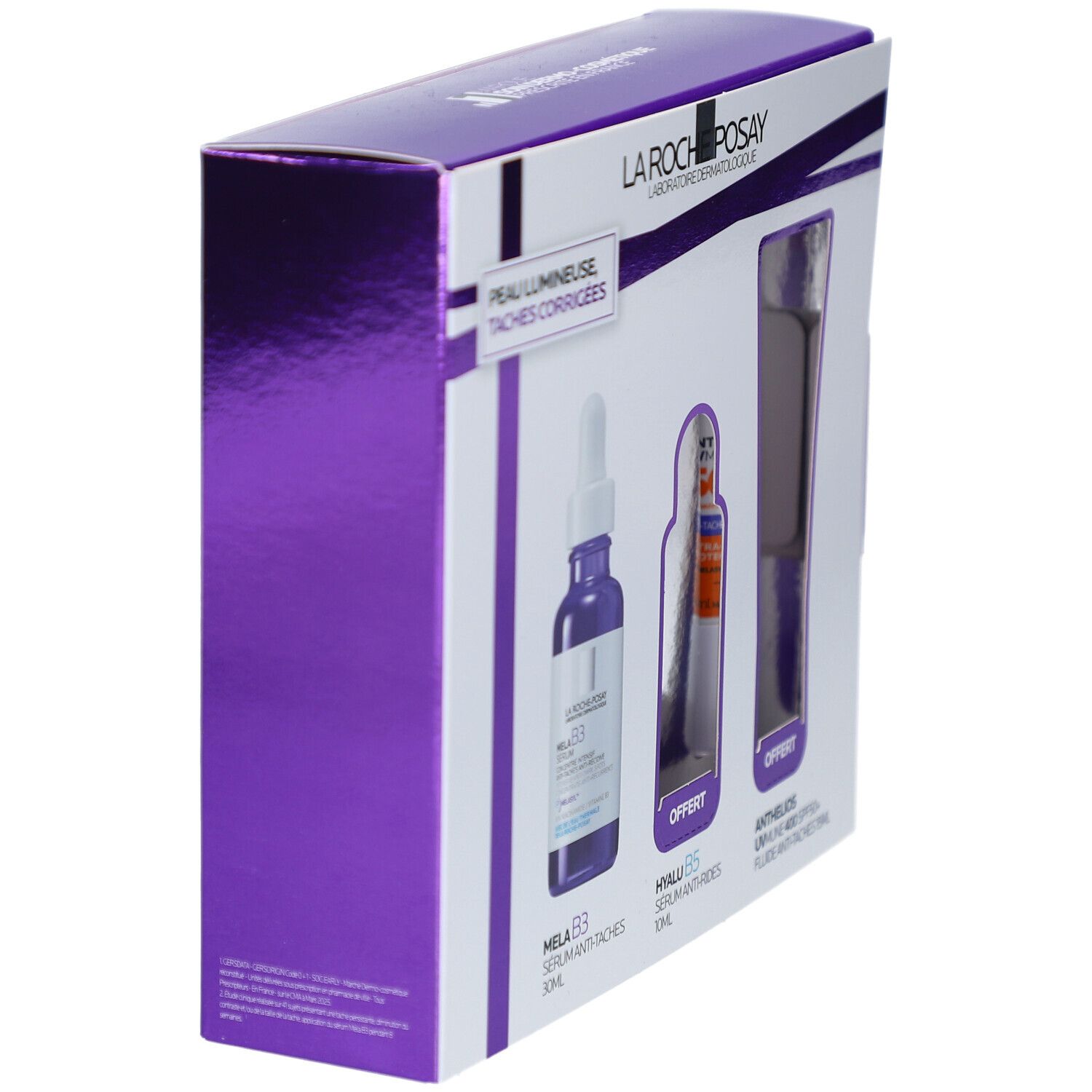 Vue en biais du coffret cadeau. Emballage violet et blanc avec images de produits. Contient MELA B3, Hyalu B5 et Anthelios.