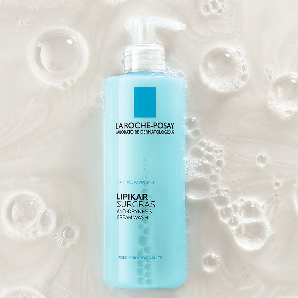 LA ROCHE-POSAY Lipikar Surgras. Flacon pompe. Emballage bleu. Texte. Bulles de mousse.