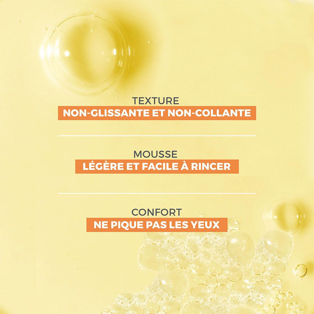 Gros plan sur des bulles de savon. Texte: Non glissant et non collant. Mousse légère et facile à rincer. Ne pique pas les yeux.