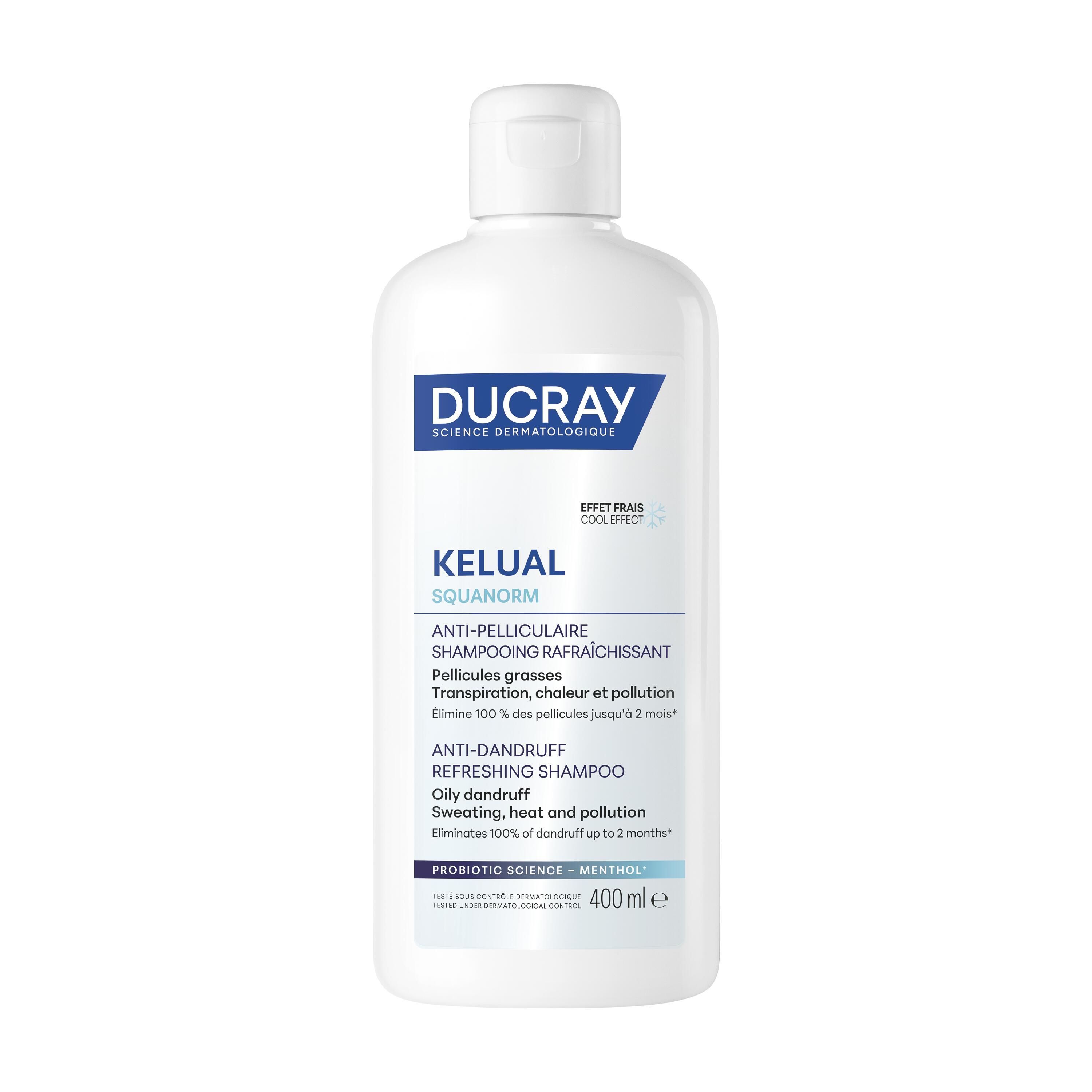Flacon blanc avec étiquette bleue. Inscription: DUCRAY, KELUAL SQUANORM, shampooing antipelliculaire. 400 ml.