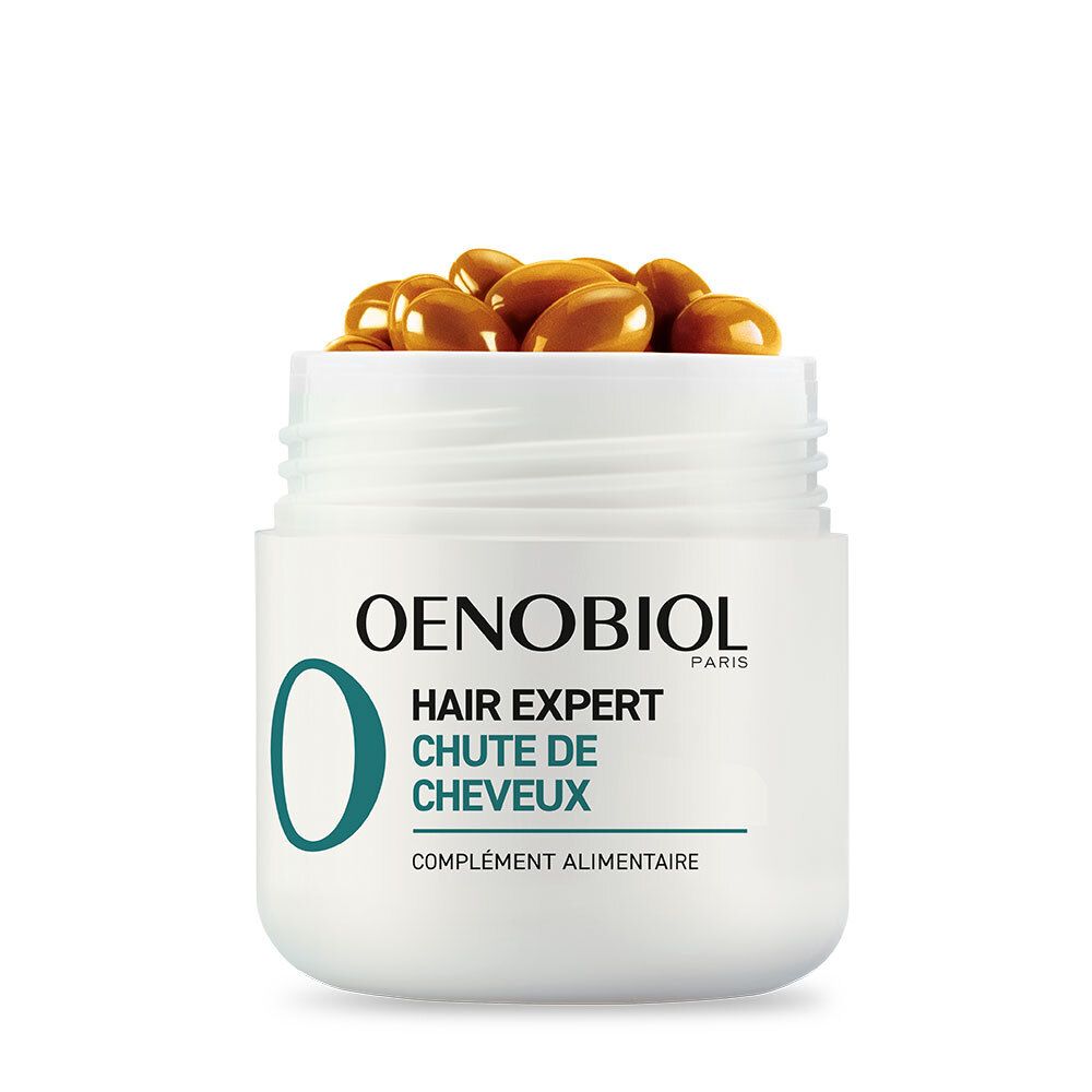 Pot blanc avec capsules brunes. Logo et texte OENOBIOL HAIR EXPERT sur le pot. Gros plan.