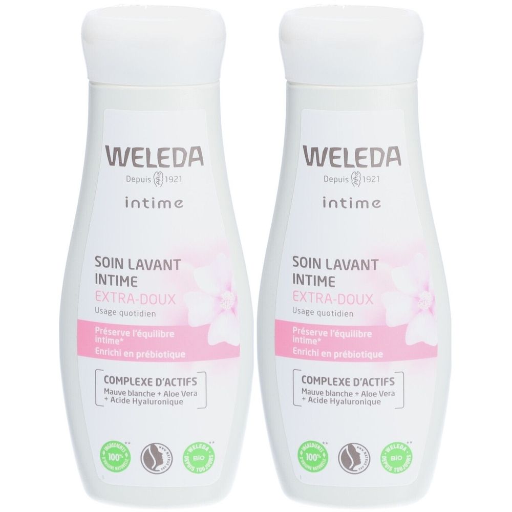 Deux flacons blancs avec étiquettes roses. Inscription : WELEDA, intime, SOIN LAVANT INTIME EXTRA-DOUX. Avec des sceaux verts.