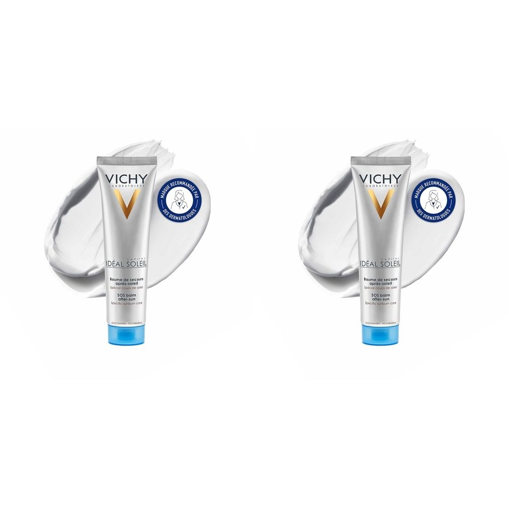 Deux tubes de crème Vichy Ideal Soleil. Design blanc et argenté, bouchon bleu. Sur fond blanc avec une trace de crème.