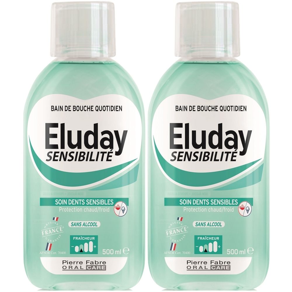 Deux flacons de bain de bouche Eluday Sensibilité. Inscription : Bain de bouche quotidien, Soin dents sensibles, 500 ml. Logo France.