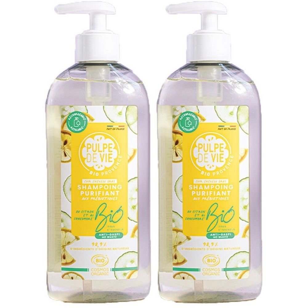 Deux flacons transparents avec pompe blanche. L'étiquette indique "PULPE DE VIE SHAMPOING PURIFIANT Bio".