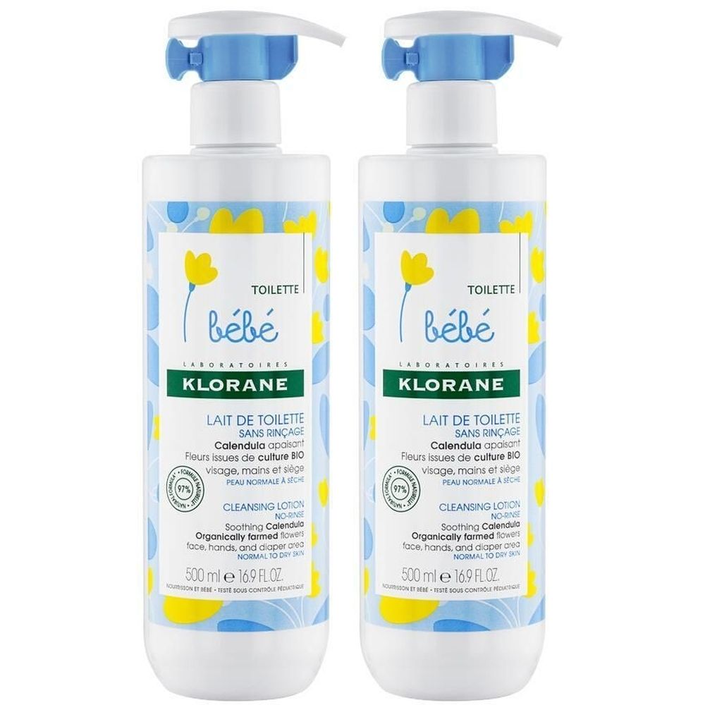 Deux flacons de Lait de Toilette Bébé Klorane. Flacons blancs avec motifs bleus et jaunes, bouchon pompe. Inscription : Bébé, Lait de Toilette.