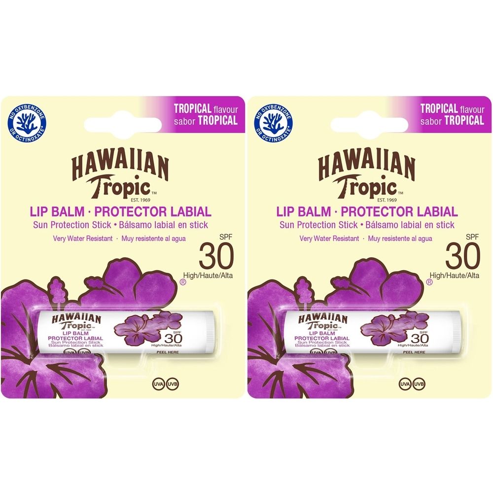 Deux sticks de baume à lèvres SPF 30. Inscription: HAWAIIAN Tropic, LIP BALM, Protector Labial. Saveur tropicale.