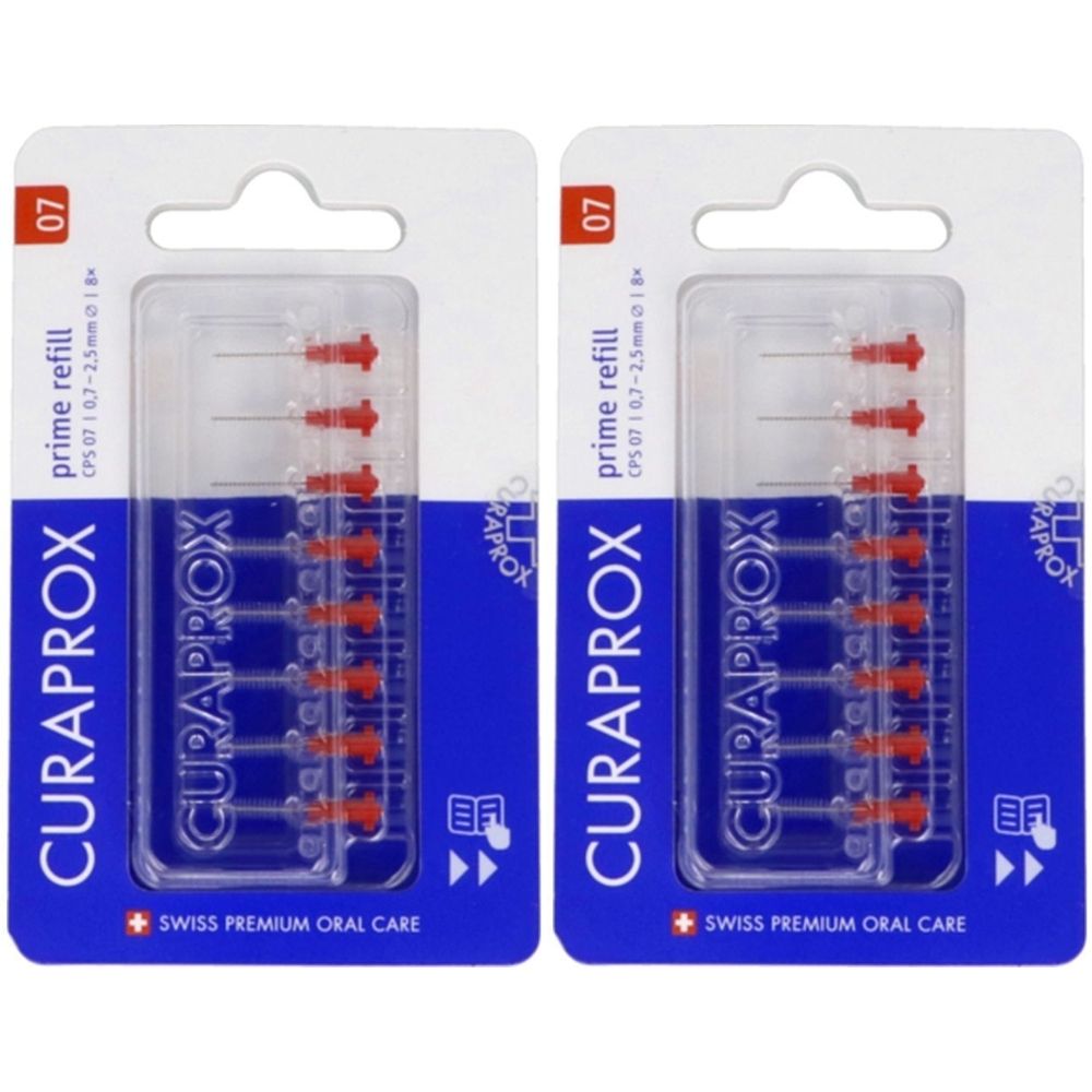 Deux paquets de recharges de brosses à dents. Emballage bleu avec texte blanc. Marque : Curaprox. Têtes de brosse rouges visibles.