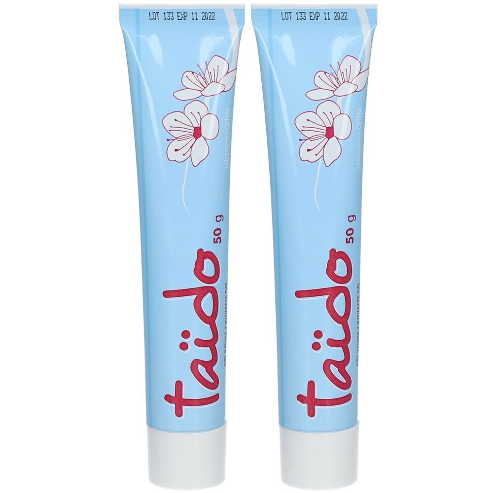 Deux tubes bleus avec des fleurs blanches. Le mot "Taïdo" en rouge et "50 g" sont visibles. Inscription "LOT 133 EXP 11 2022" en haut.