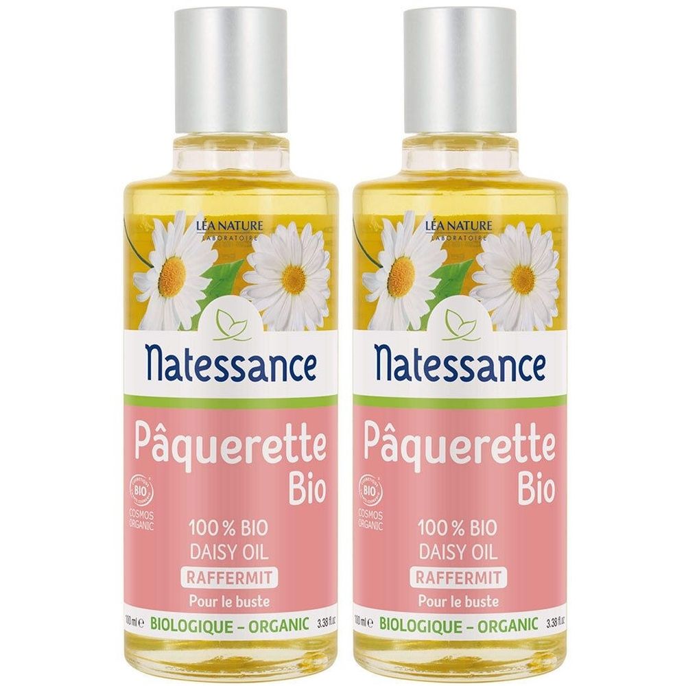 Deux flacons d'huile Natessance Pâquerette Bio. Étiquette avec illustration de marguerites, fond rose, bouchon argenté.