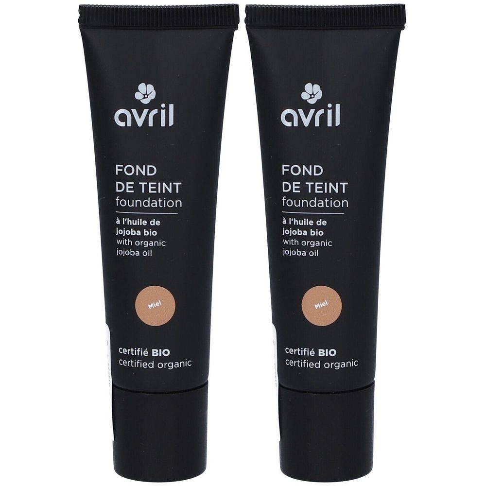 Deux tubes noirs de fond de teint. Inscription: Avril, FOND DE TEINT, foundation, certifié BIO, couleur Miel. Huile de jojoba bio.