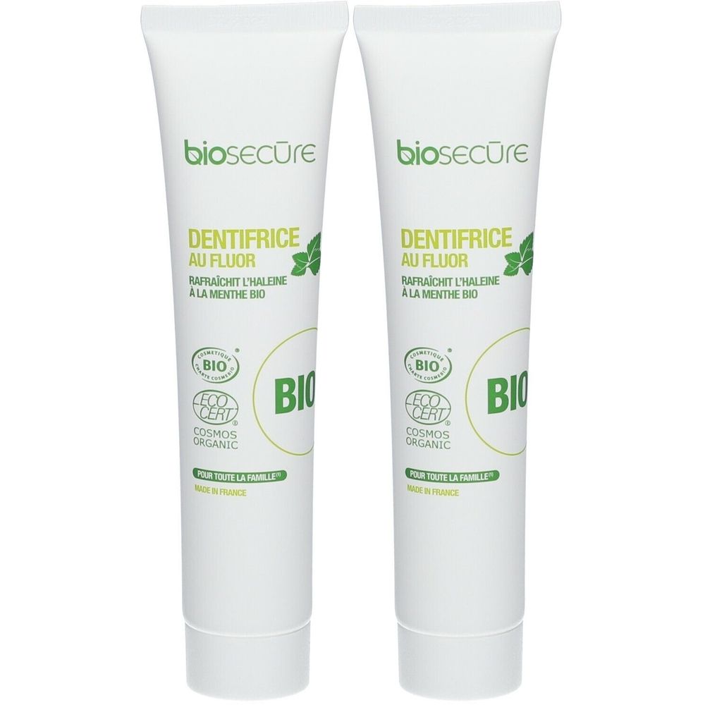 Deux tubes de dentifrice biosecure. Inscription: DENTIFRICE AU FLUOR, certification BIO. Tubes blancs avec texte vert.