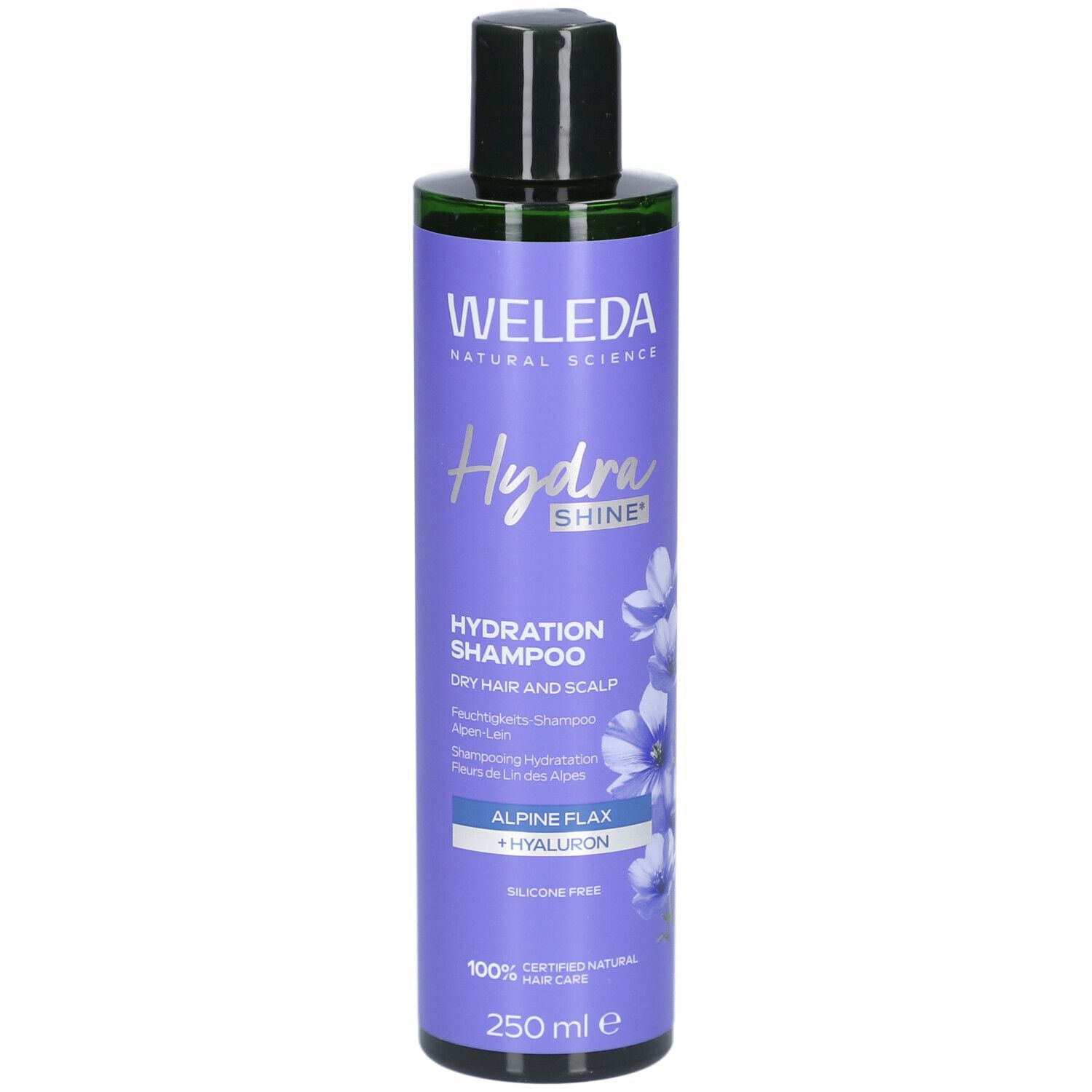 Flacon de shampooing violet avec bouchon noir. Inscription: WELEDA Hydra Shine Shampooing Hydratation. Avec lin alpin et hyaluron.