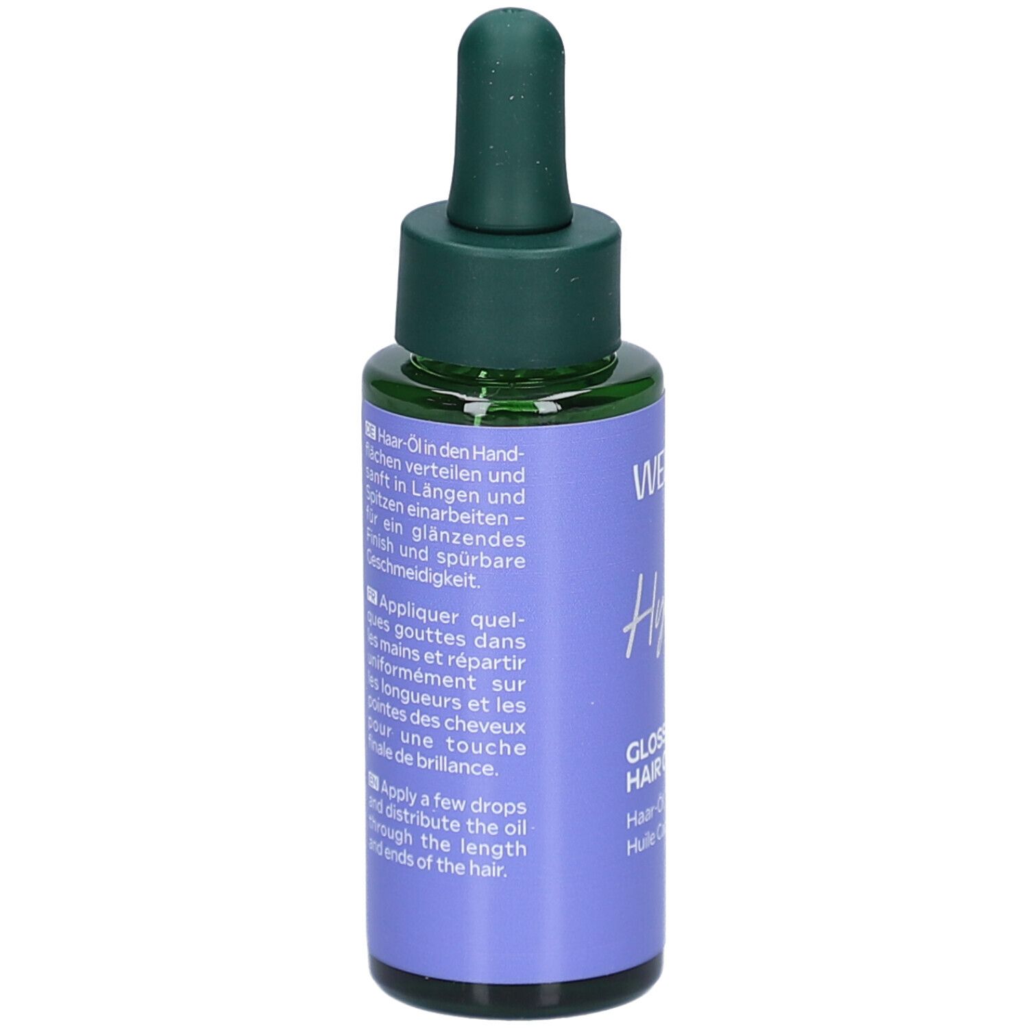 Dos du flacon avec texte. WELEDA Hydra Shine, Gloss Drops Hair Oil. Instructions en allemand, anglais et français.