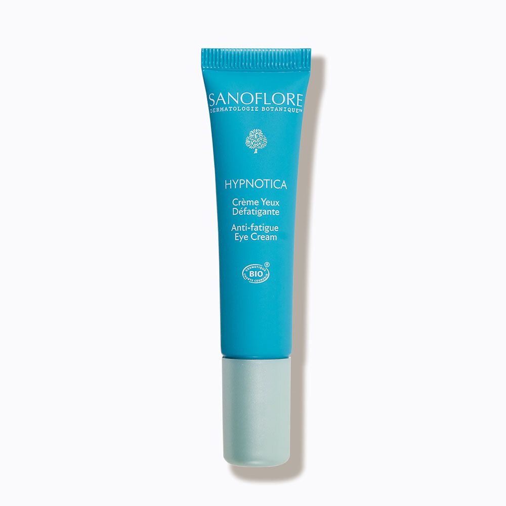 Tube turquoise de crème pour les yeux. Inscription: Sanoflore, Hypnotica, Crème Yeux Défatigante, Anti-fatigue Eye Cream. Label Bio.