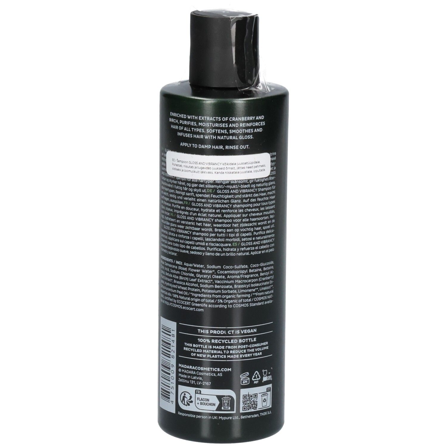 Arrière d'un flacon de shampoing vert. L'étiquette contient les ingrédients, les instructions et les sceaux.