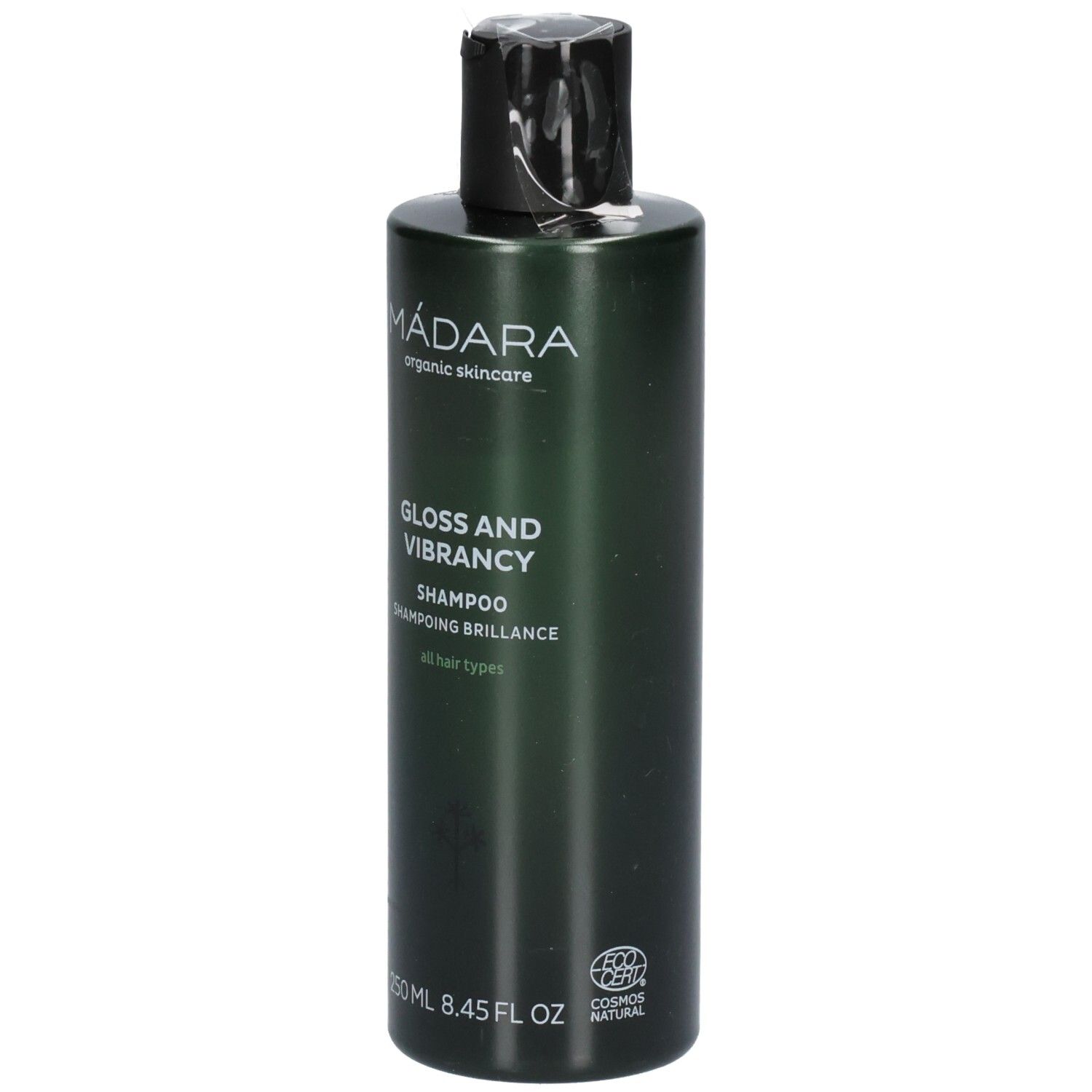 Flacon de shampoing vert avec bouchon noir. Étiquette : MÁDARA, Gloss and Vibrancy Shampoo, 250 ml.