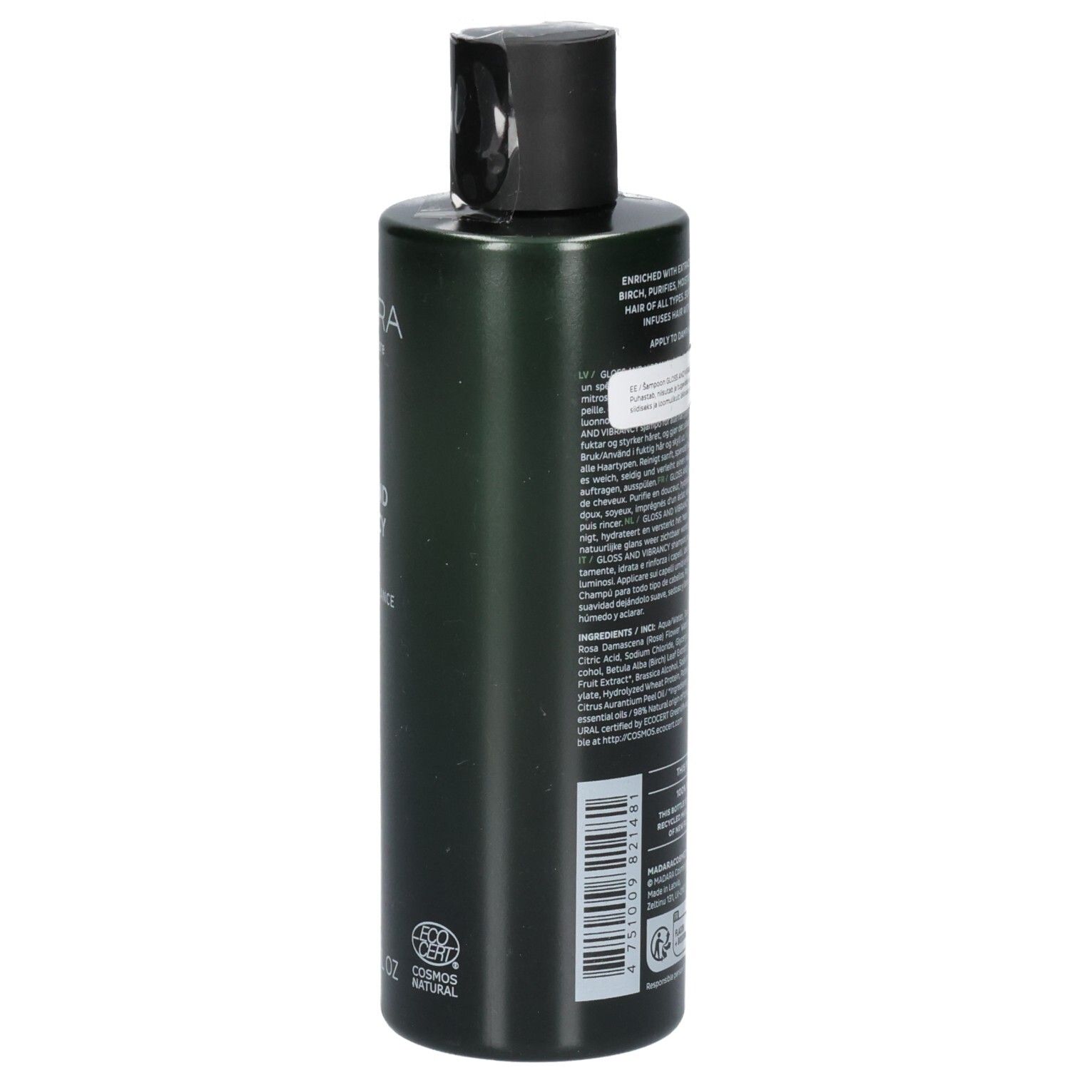 Arrière d'un flacon de shampoing vert. L'étiquette contient les ingrédients et les instructions d'utilisation.