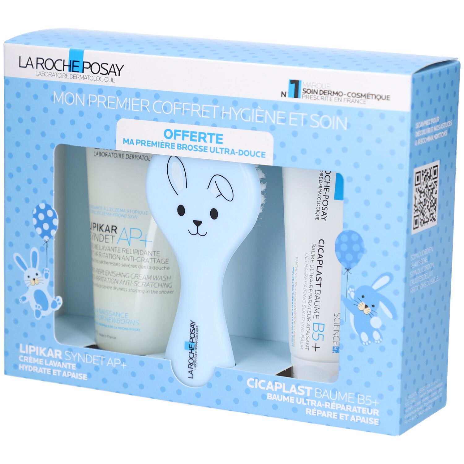 Coffret de soins pour bébé. Contient crème, baume et brosse bleue en forme de lapin. Texte: LA ROCHE POSAY.