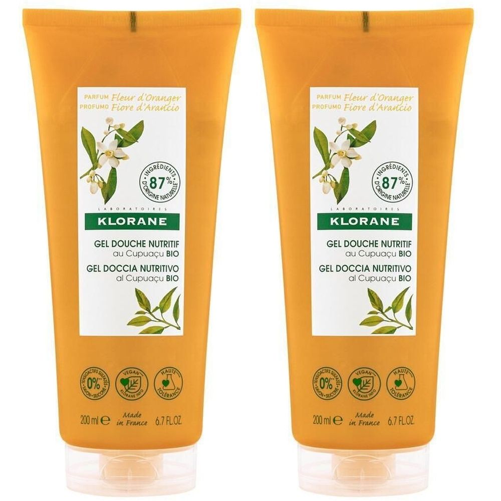 Deux tubes orange de gel douche KLORANE. Inscription: Gel Douche Nutritif au Cupuaçu BIO. 87% d'ingrédients d'origine naturelle.