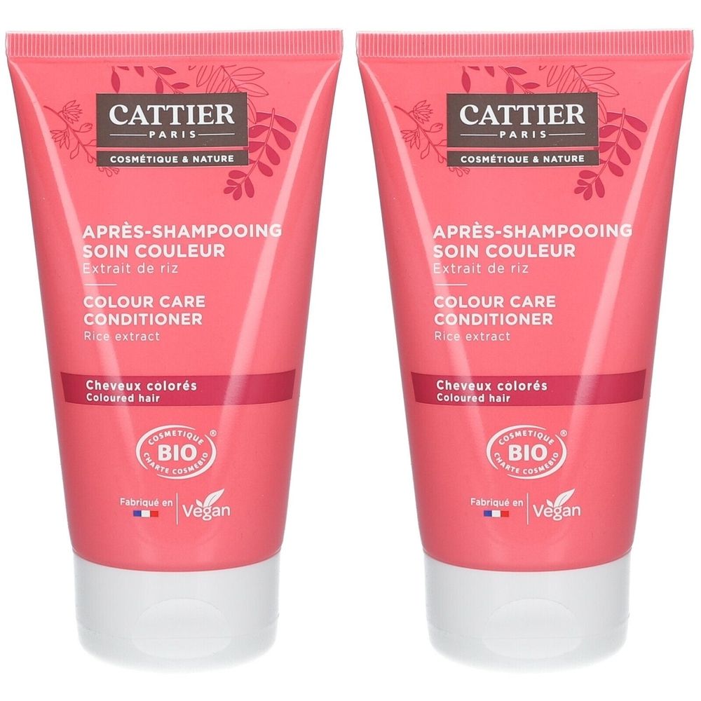 Deux tubes de soin capillaire rose. Inscription: CATTIER PARIS, Après-Shampooing Soin Couleur, Colour Care Conditioner. Certification Bio.