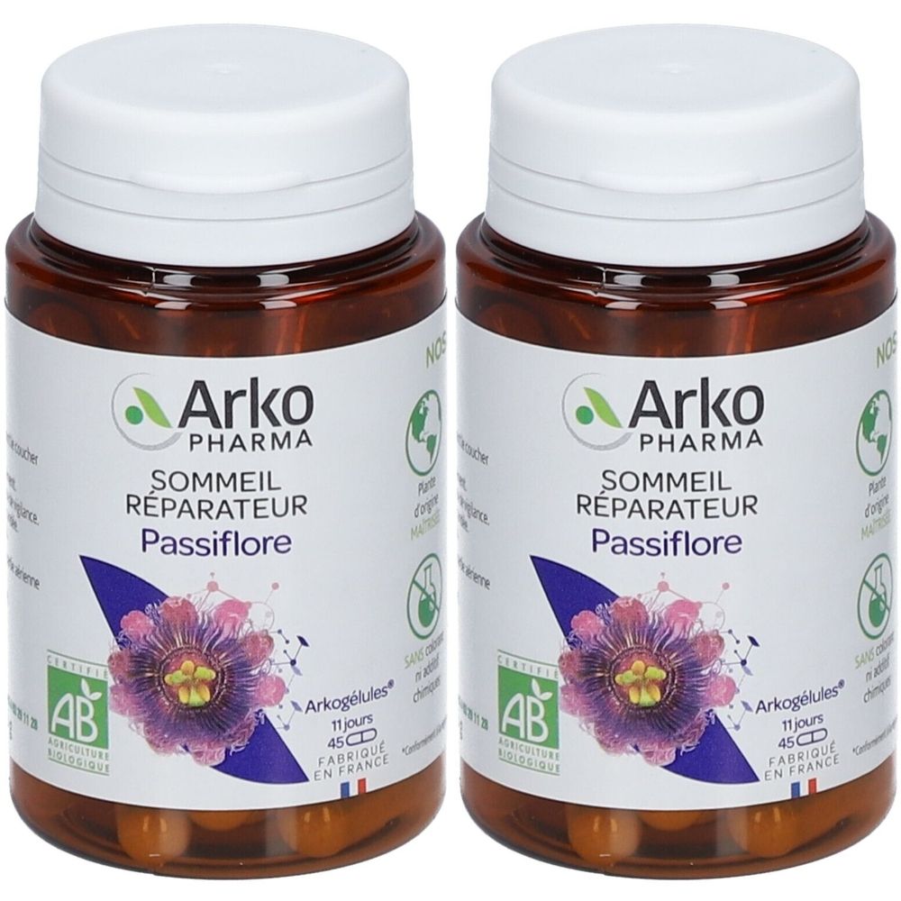Deux flacons bruns avec des couvercles blancs. Étiquettes avec "Arko Pharma", "Sommeil Réparateur Passiflore" et une fleur violette.