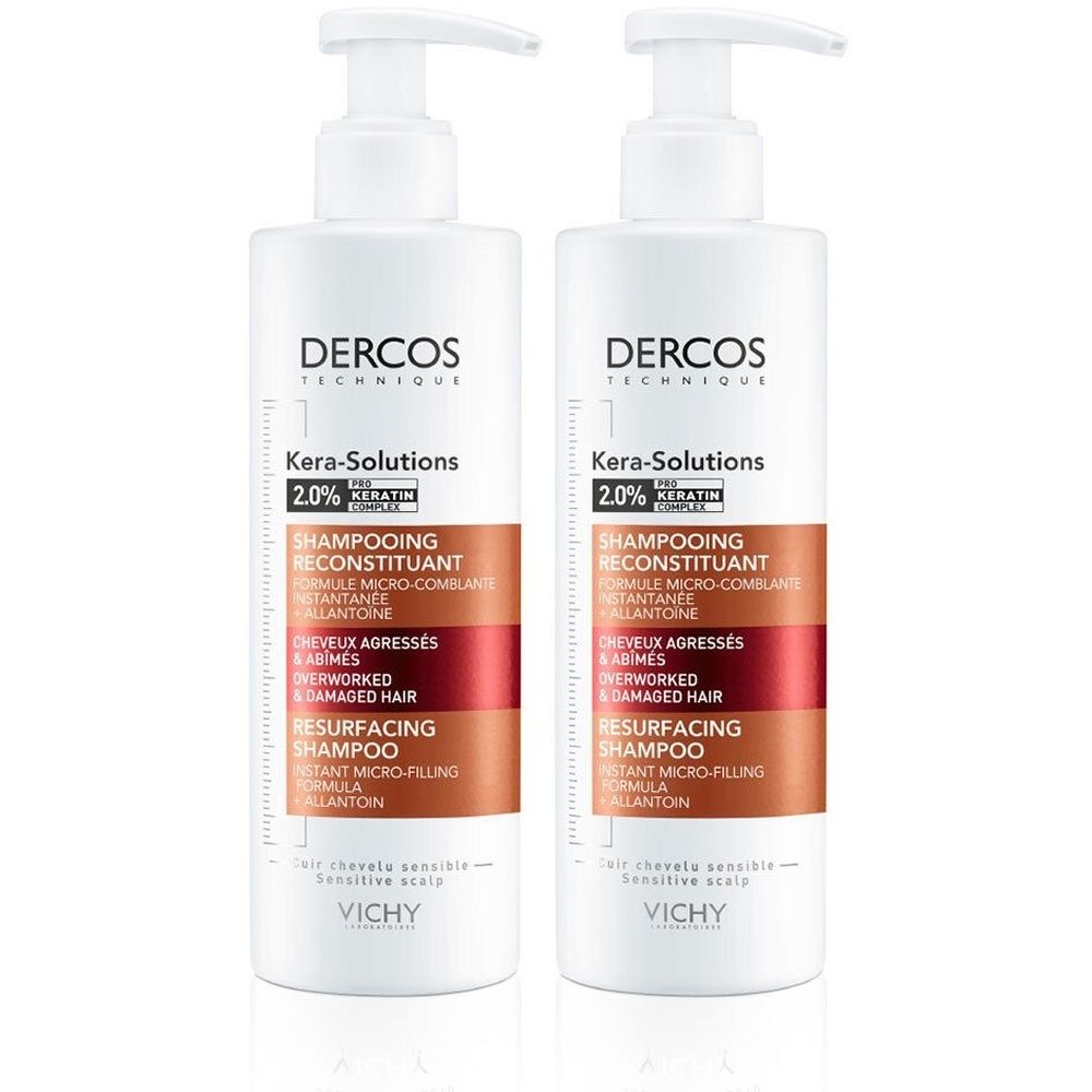 Deux flacons blancs avec pompe. Inscription: Dercos Technique Kera-Solutions, Shampooing Reconstituant. Pour cheveux abîmés.