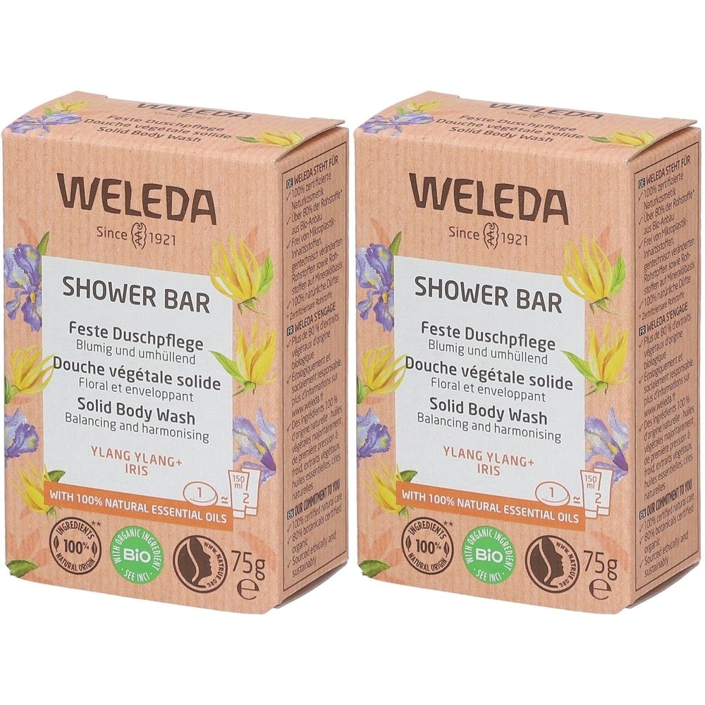 Deux boîtes rectangulaires WELEDA SHOWER BAR. Inscriptions : Feste Duschpflege, Douche végétale solide, Solid Body Wash, Ylang Ylang Iris. Certifications.