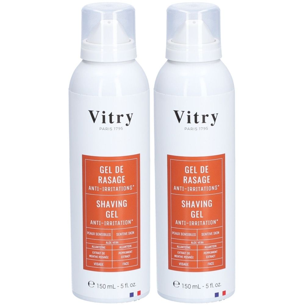 Deux flacons blancs avec vaporisateur. Étiquette orange avec "GEL DE RASAGE ANTI-IRRITATIONS" et "SHAVING GEL ANTI-IRRITATION". Marque : Vitry.