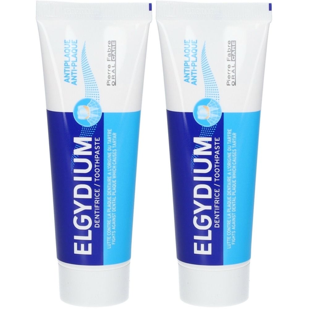 Deux tubes de dentifrice ELGYDIUM Anti-Plaque. Emballage blanc et bleu avec nom et texte du produit. Inscription : Anti-Plaque.