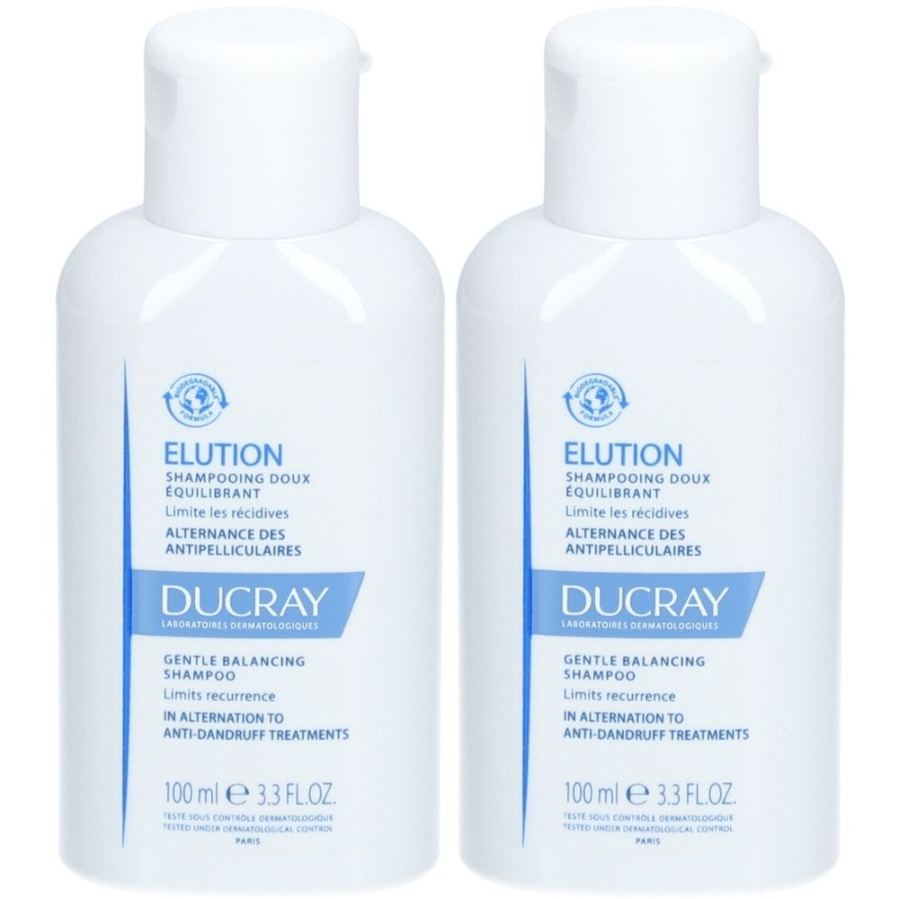 Deux flacons blancs avec bouchon rabattable. Inscription : Elution Shampooing doux équilibrant, Ducray. 100 ml.
