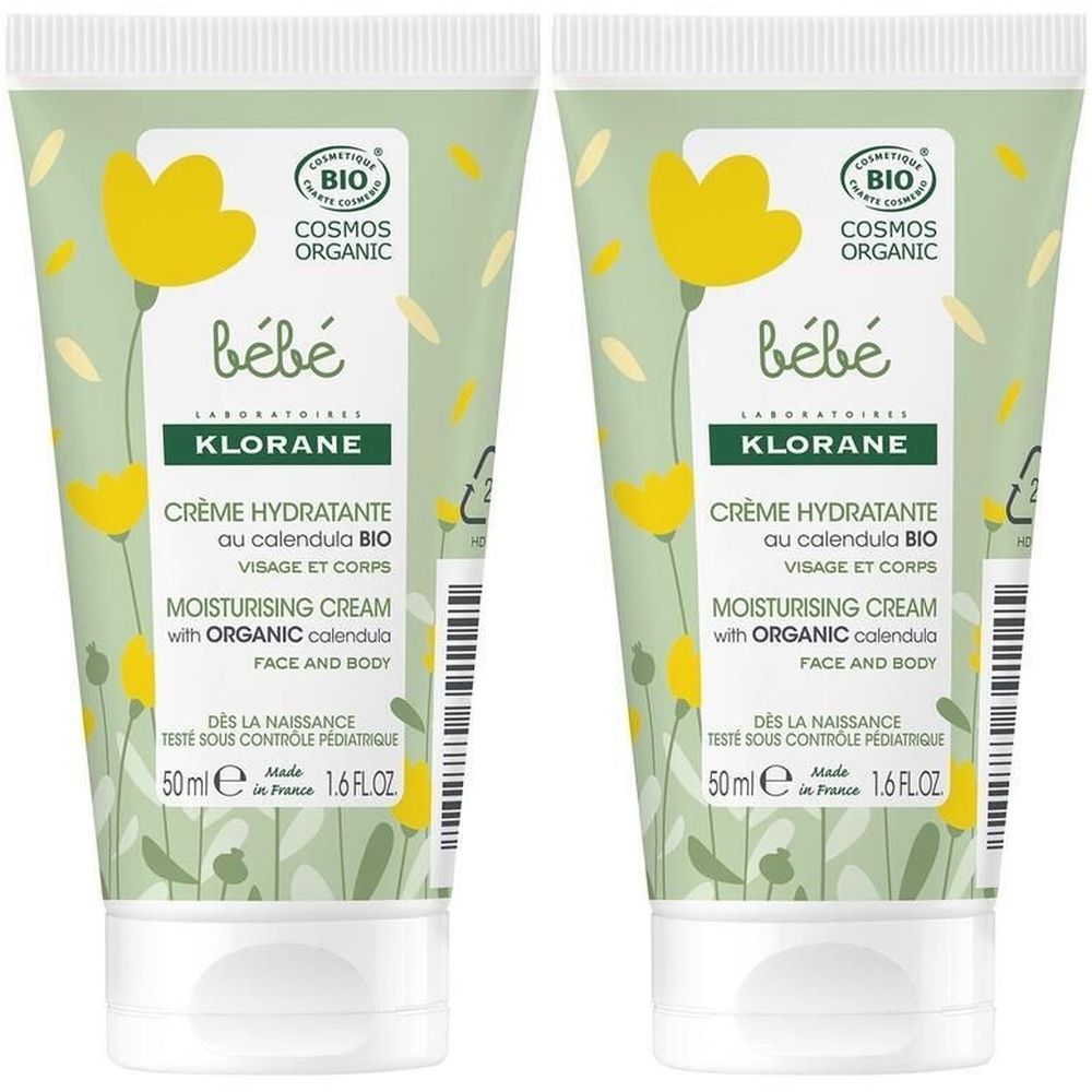 Deux tubes de KLORANE Bébé Crème hydratante. Design vert et blanc avec fleurs jaunes. Texte: Crème hydratante, au calendula BIO, visage et corps.